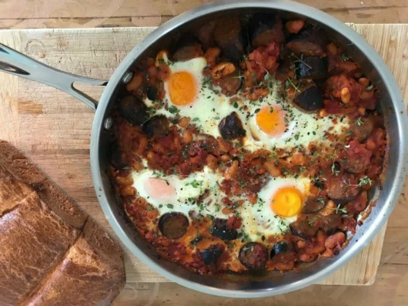 beans with venison and thyme sausages and baked eggs