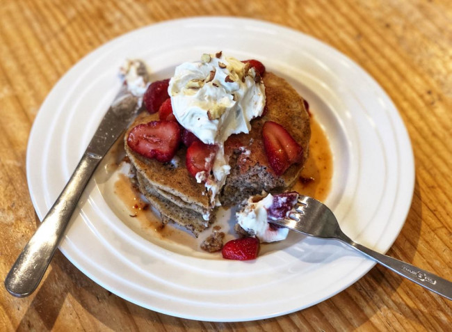 hazelnut pancakes with macerated strawberries and whipped coconut cream