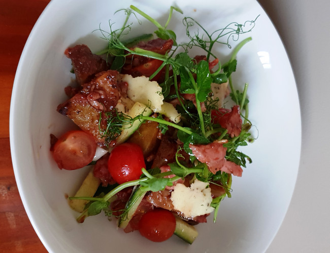 kumara and pea shoot salad with plum vinaigrette