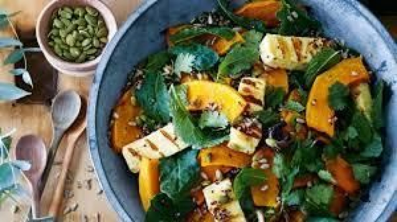 pumpkin kale hazelnut salad with grilled evansdale curd and tahini dressing