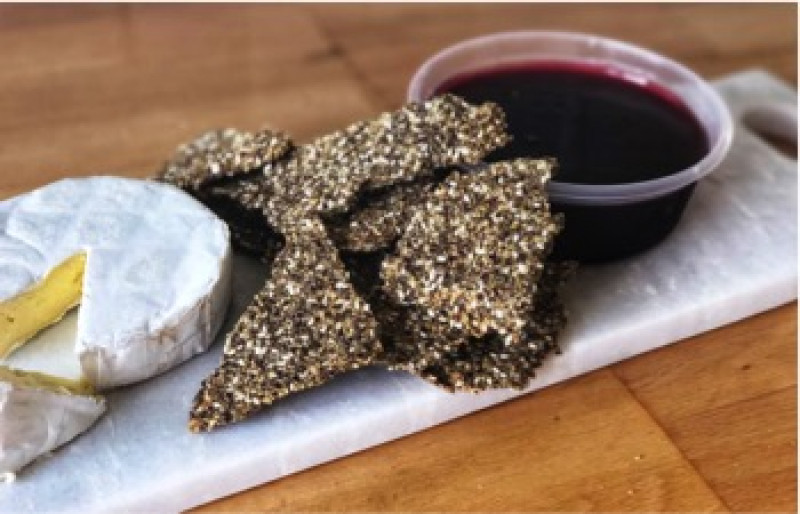 rosemary and seed crackers served with spiced plum jelly and farmhouse brie