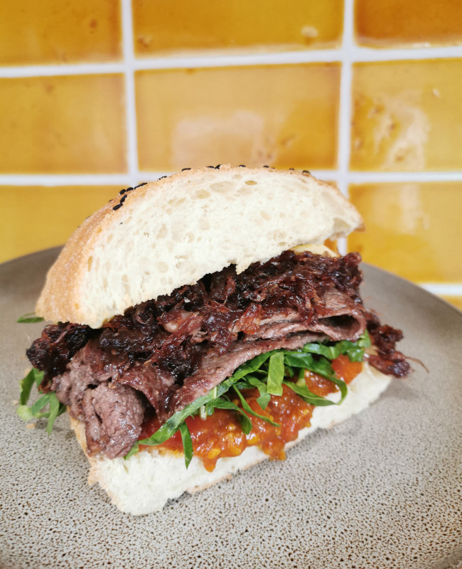 steak sandwich with caramalised red onion and kasundi