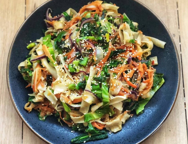 stir fry vegetables with peanut sauce and rice noodles