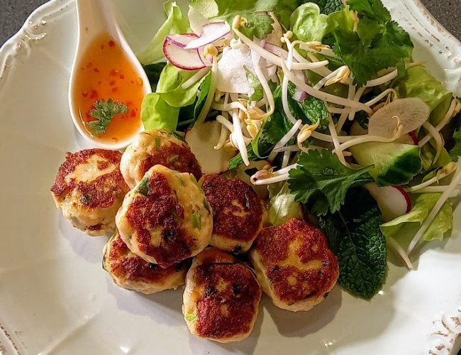 thai fish cakes with thai dipping sauce and salad photo