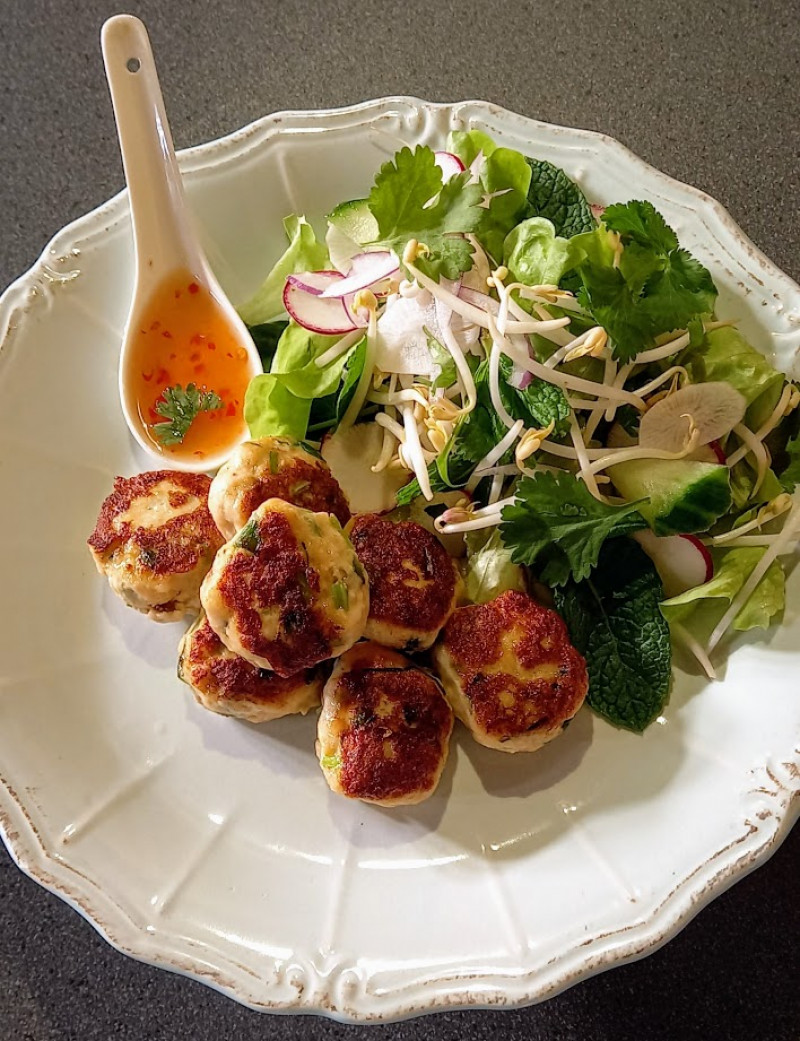 thai fish cakes with thai dipping sauce and salad photo